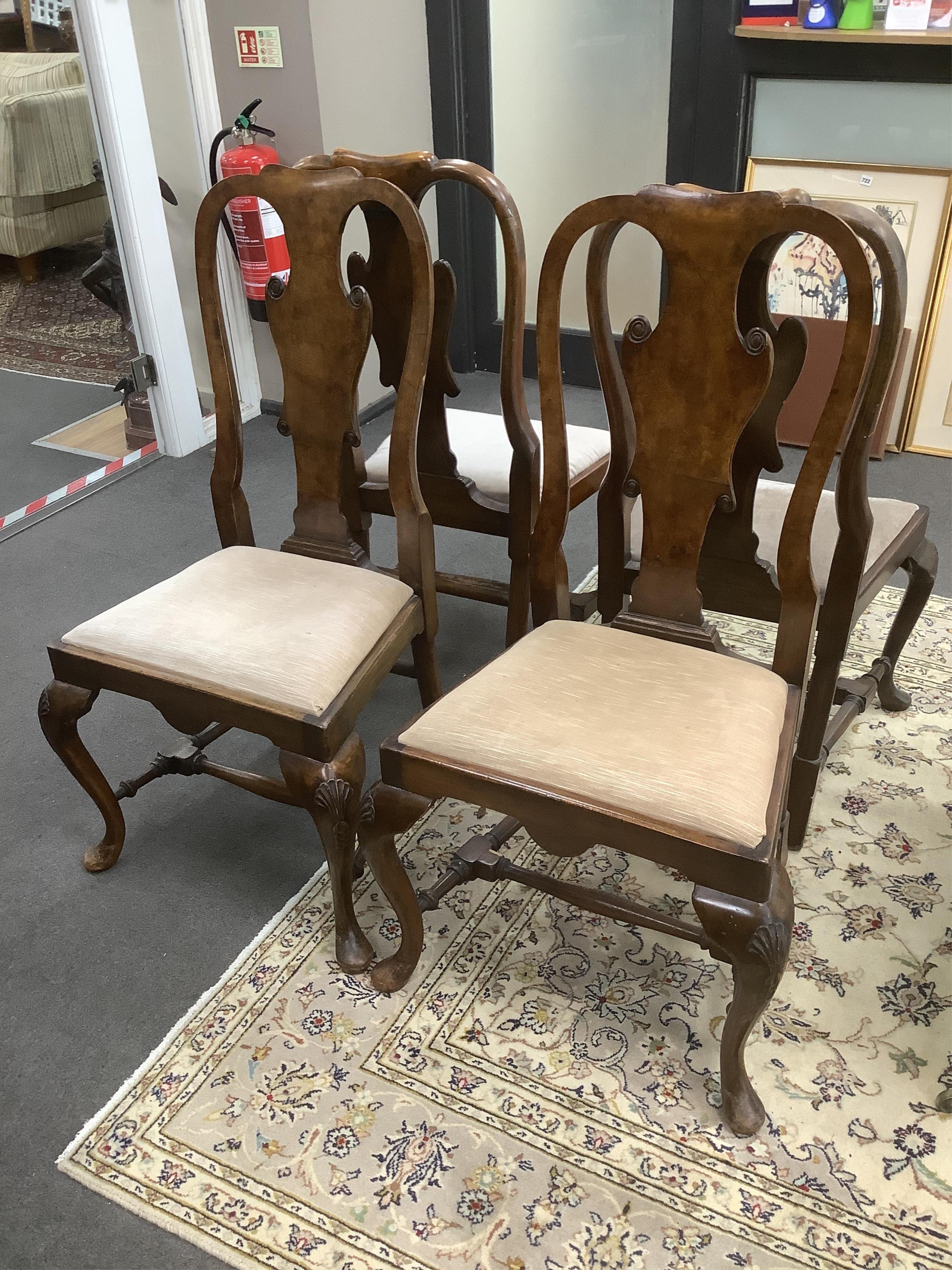 A set of four Queen Anne revival walnut dining chairs, width 52cm, depth 40cm, height 107cm. Condition - fair